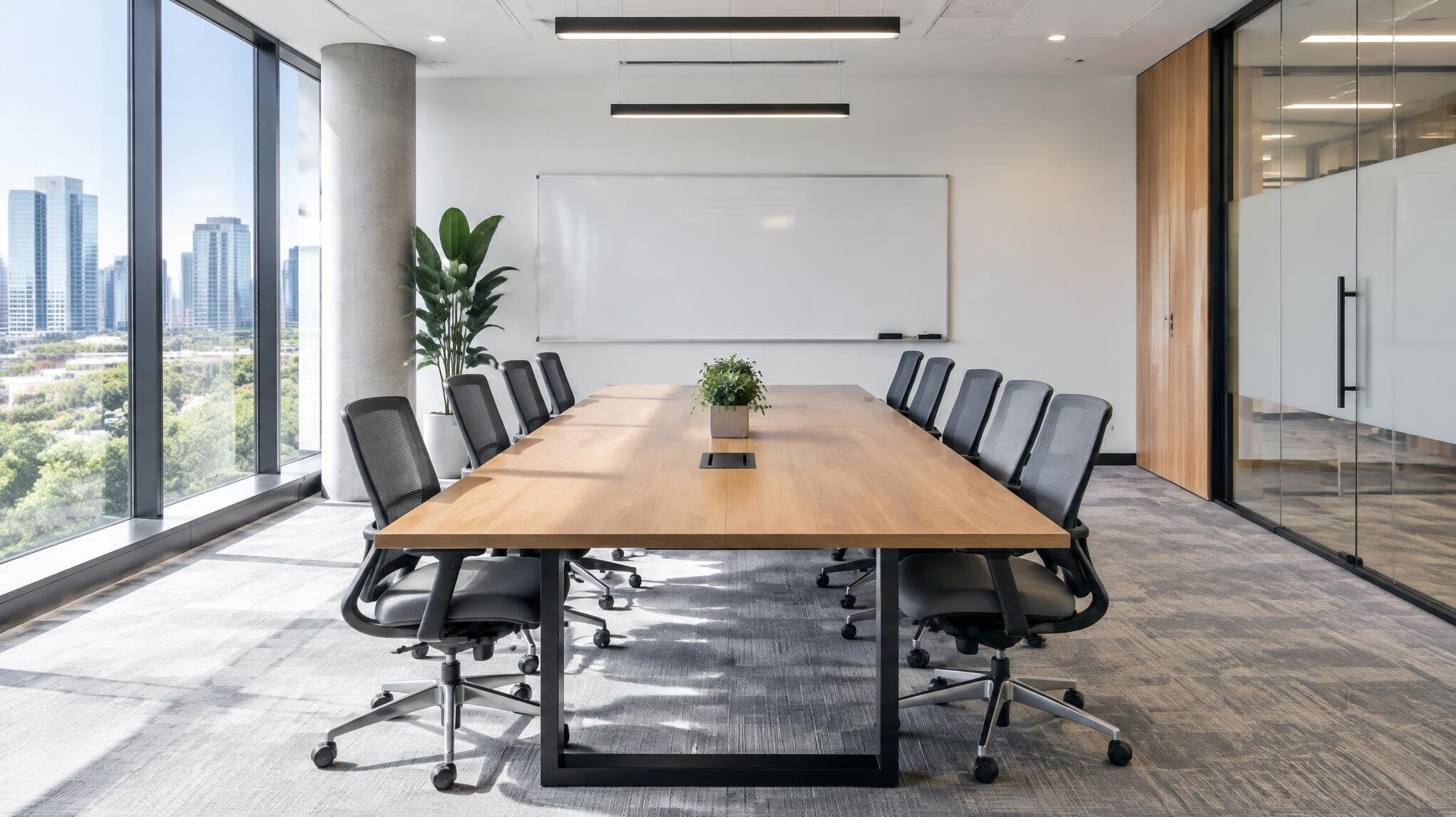 Empty modern meeting room with a long table and chairs